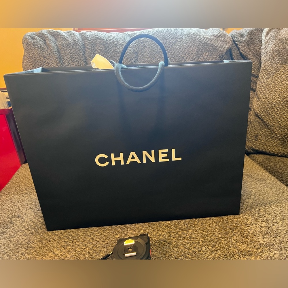 Chanel shopping bag with Chanel flower and ribbon